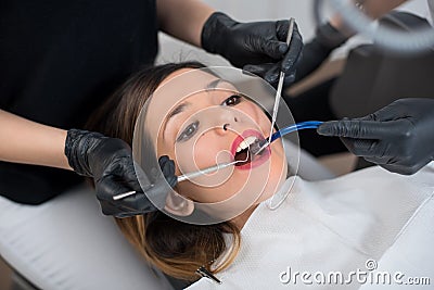 Beautiful girl having dental check up in dental clinic. Dentistry Stock Photo