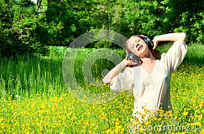 Beautiful girl in headphones enjoying music Stock Photo