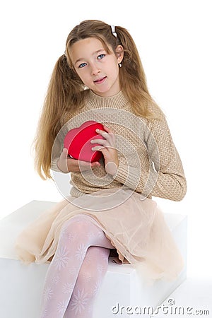 Beautiful girl holding red heart Stock Photo