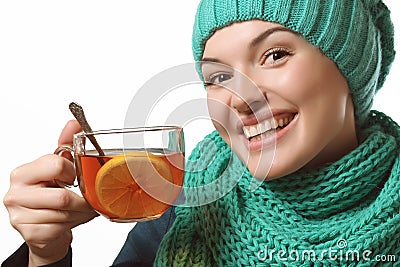 Beautiful girl holding tea with lemon, recovery Stock Photo