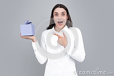 Beautiful girl holding valentines gift. Expressive facial expressions with suprised face. Happy birthday celebration Stock Photo