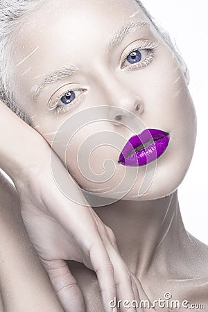 Beautiful girl in the image of albino with purple lips and white eyes. Art beauty face. Stock Photo