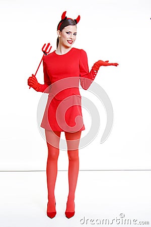 Beautiful girl like little devil in red dress Stock Photo