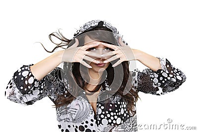 Beautiful girl lookiing through her fingers Stock Photo