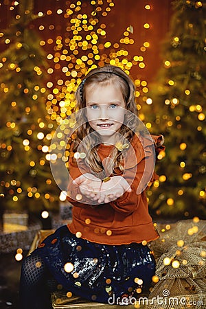 A happy little girl makes a wish Stock Photo