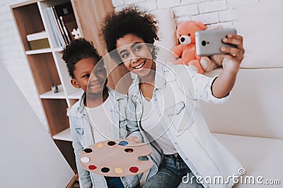 Beautiful Girl with Mother Selfie at Home Together Stock Photo