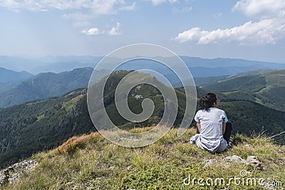 Beautiful girl in the mountains. An incredible view of the Troyan Balkan. The mountain captivates with its beauty, fresh air. Editorial Stock Photo