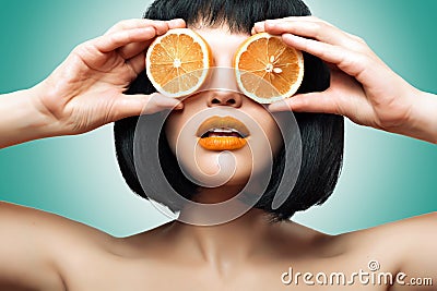 Girl with orange. Bright makeup, Ombre Stock Photo