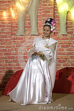 A beautiful girl performing a traditional Thai dance. Editorial Stock Photo