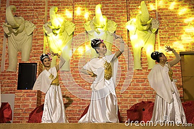 A beautiful girl performing a traditional Thai dance. Editorial Stock Photo