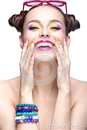 Beautiful girl in pink sunglasses with bright makeup and colorful nails. Beauty face. Stock Photo