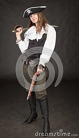 Beautiful girl - pirate with sabre and pistol Stock Photo