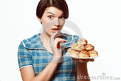 Beautiful girl with a plate of bakery products, diet, calories Stock Photo