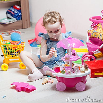 Beautiful girl plays toys Stock Photo