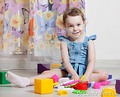 Beautiful girl plays toys Stock Photo