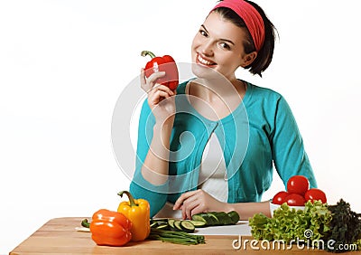 Beautiful girl is preparing to eat. Fresh vegetables. Salad vegetarian. Stock Photo