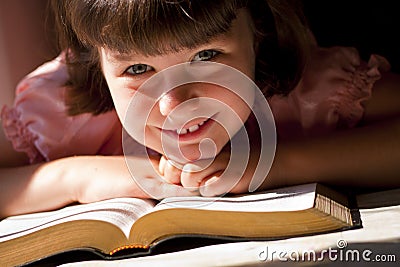 Beautiful Girl Reading Holy Bible Stock Photo