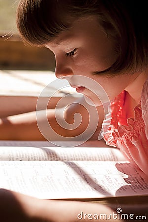 Beautiful Girl Reading Holy Bible Stock Photo