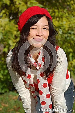 Beautiful girl in red beret smiling Stock Photo