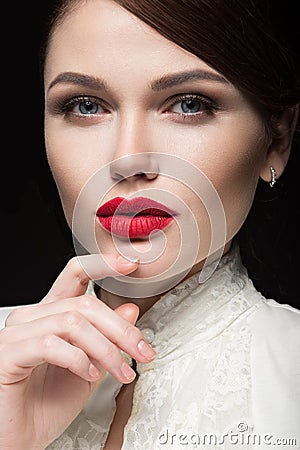 Beautiful girl with red lips in white clothes in the form of retro. Beauty face. Stock Photo