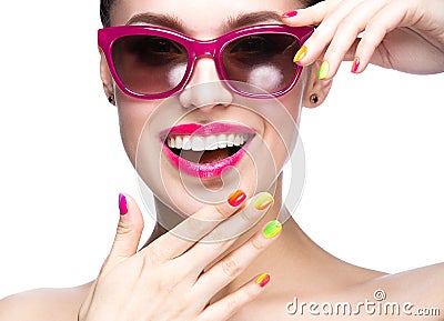 Beautiful girl in red sunglasses with bright makeup and colorful nails. Beauty face. Stock Photo