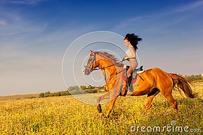 Beautiful girl riding a horse Stock Photo