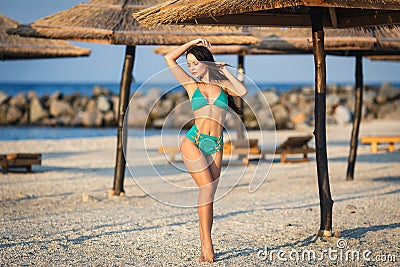 Beautiful girl in a bikini on the beach Stock Photo