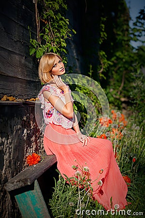 Beautiful girl sitting on bench Stock Photo