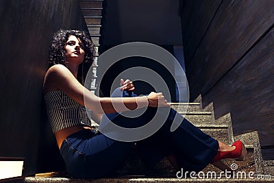 Beautiful girl on stairs Stock Photo