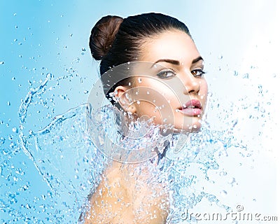 Beautiful girl under splash of water Stock Photo