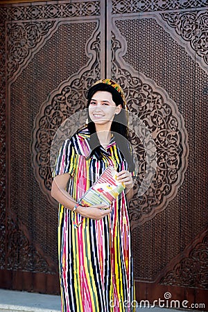 Beautiful girl in Uzbekistan, national fancy folk dress. Stock Photo