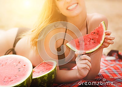 Beautiful girl with watermelon near the sea Stock Photo