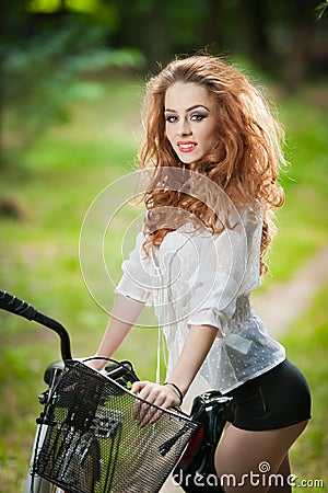 https://thumbs.dreamstime.com/x/beautiful-girl-wearing-white-lace-blouse-black-sexy-shorts-having-fun-park-bicycle-pretty-red-hair-woman-posing-near-44726847.jpg