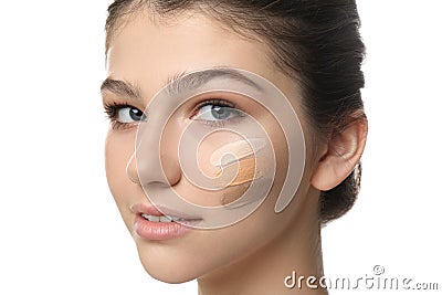 Beautiful girl on white background, closeup. Using concealer and foundation for face contouring Stock Photo