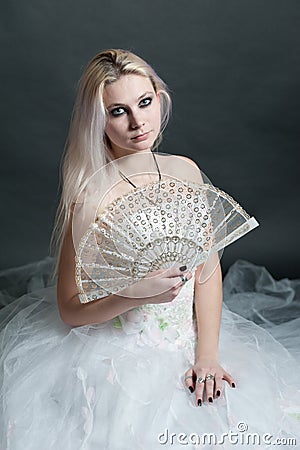 Beautiful girl in white dress on black Stock Photo