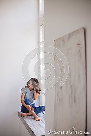 Beautiful girl by the window. Stock Photo