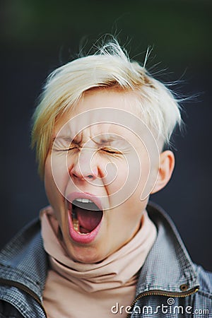 Beautiful girl yawns or pain Stock Photo