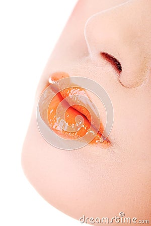 Beautiful glossy, orange woman lips Stock Photo