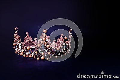 Beautiful golden queen crown in dark key Stock Photo