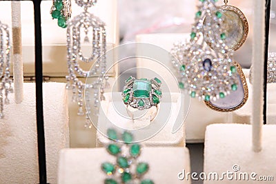 Gorgeous expensive ring with emeralds and diamonds Stock Photo