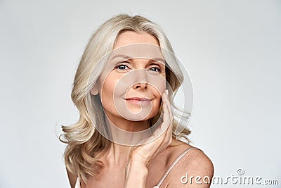 Beautiful gorgeous mid aged mature woman looking at camera isolated on white. Stock Photo