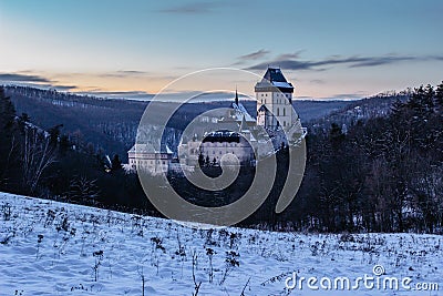 Beautiful gothic Royal Karlstejn Castle in winter with snow,Czech Republic.Founded by Charles IV.There are Czech crown jewels, Stock Photo