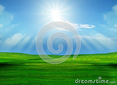 Beautiful grass field and sun shining on blue sky Stock Photo