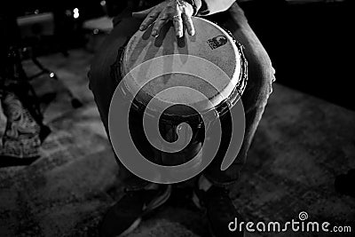 Beautiful grayscale view of Djembe drum player's hand on drum Editorial Stock Photo