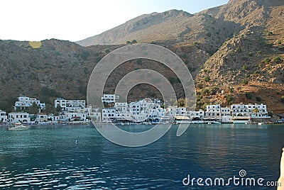 Beautiful Greek blue and white houses on the shores of Crete in the Mediterranean Stock Photo