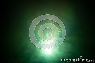 Beautiful green color light beam at night . smoke texture spotlight . screening abstract background . Stock Photo