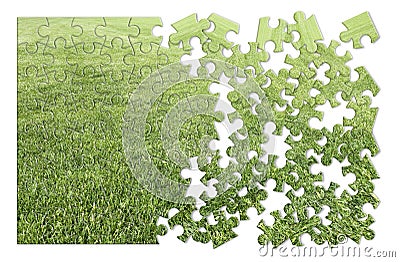 Beautiful green mowed lawn in puzzle shape on white background Stock Photo