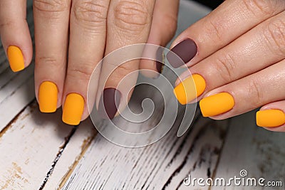 Beautiful groomed woman& x27;s hands, nails on the light gray background Stock Photo