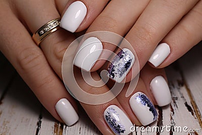 Beautiful groomed woman& x27;s hands, nails on the light gray background Stock Photo