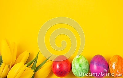 Beautiful group Easter eggs in the spring of easter day, red eggs, blue, purple and yellow on the Yellow background Stock Photo